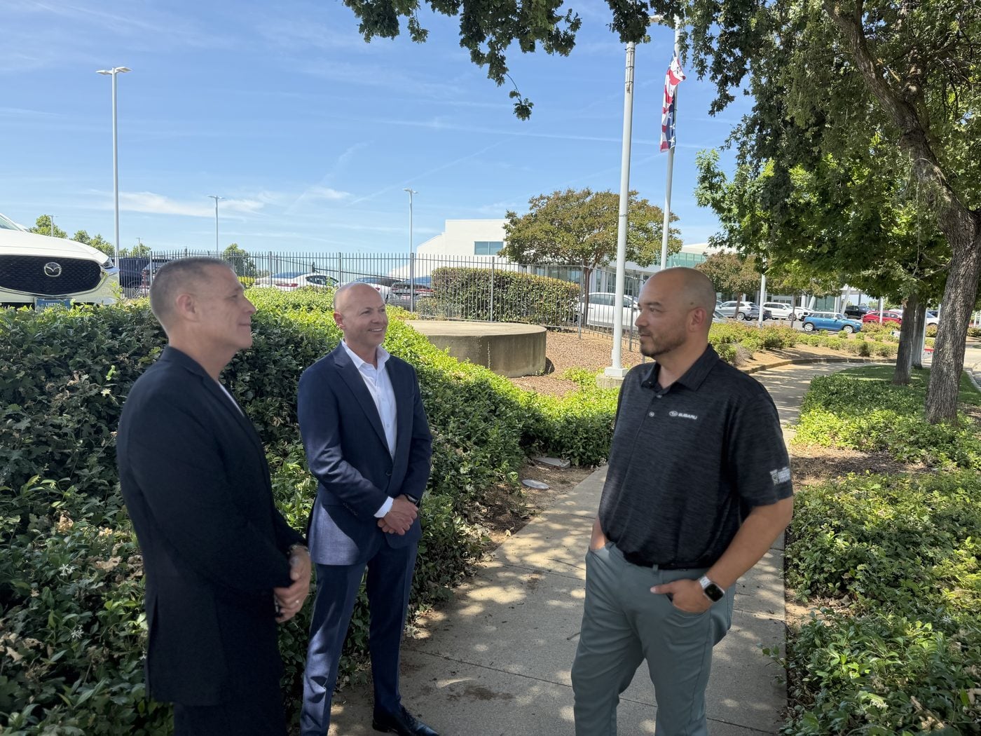 Charlie, David, and Tom on the new-property walkway at Elk Grove Subaru